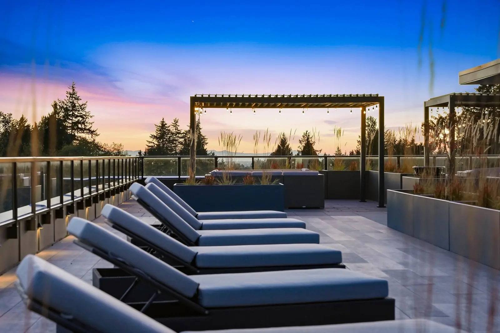 Rooftop loungers at sunset at Scott + 77, North Delta