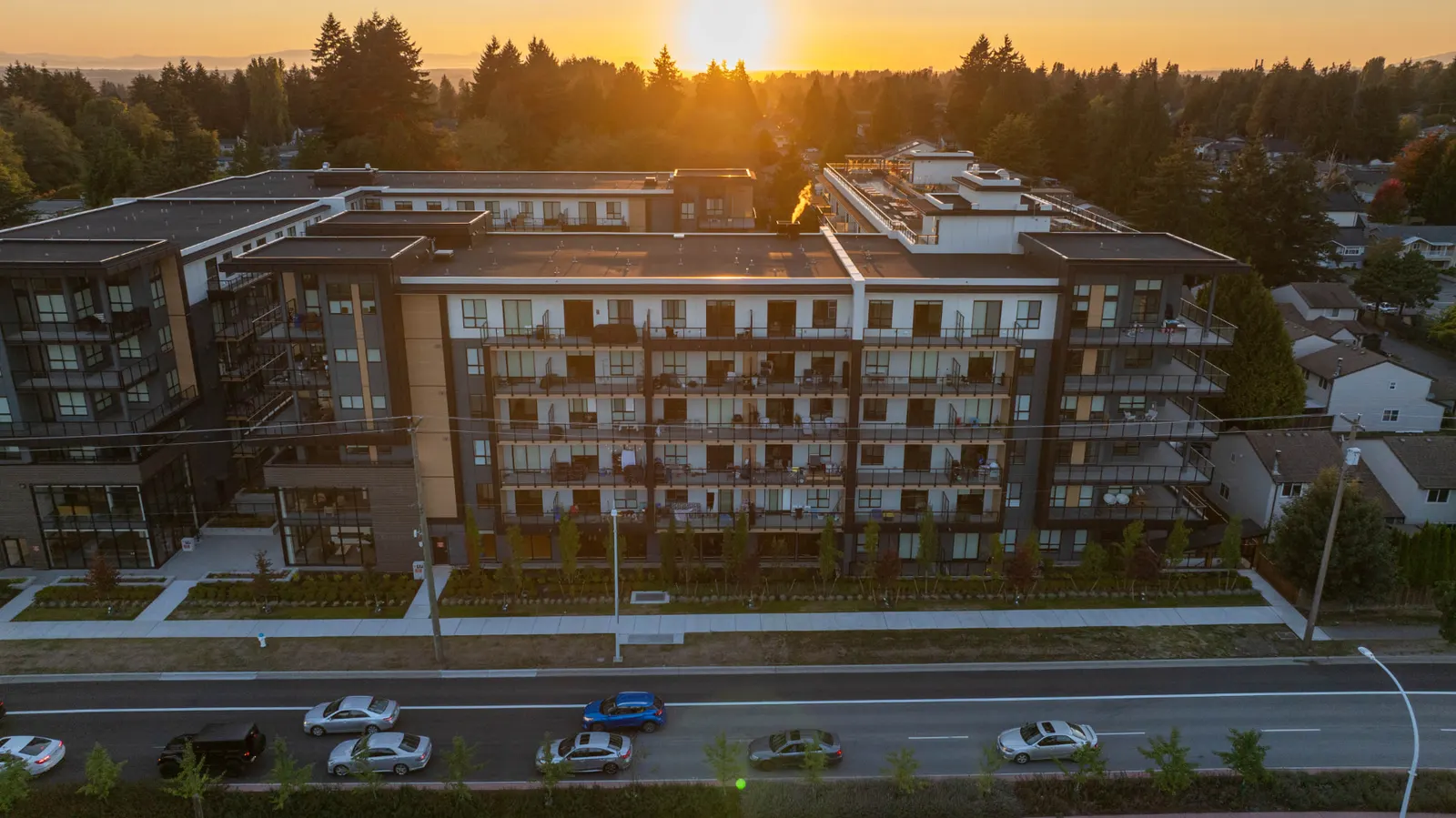 Completed Scott + 77 building exterior at sunset, North Delta