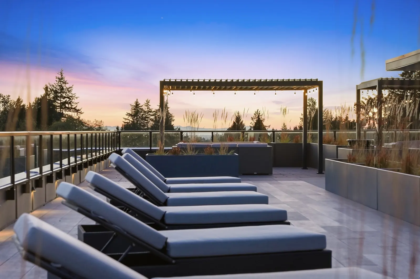 Rooftop loungers and pergola at sunset at Scott + 77, North Delta